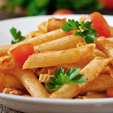Pasta in tomato sauce with fresh toppings